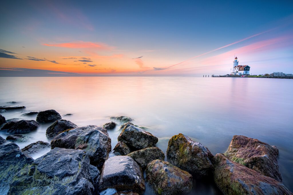 The &quot;Het Paard van Marken&quot; lighthouse at sunrise. Marken is a small fishing village on the Markermeer.