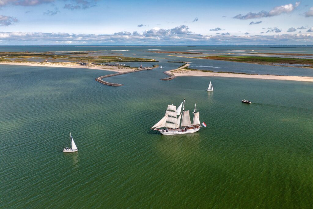 The three-masted ship Abel Tasman sailing in the Marker Wadden archipelago on Lake Markermeer