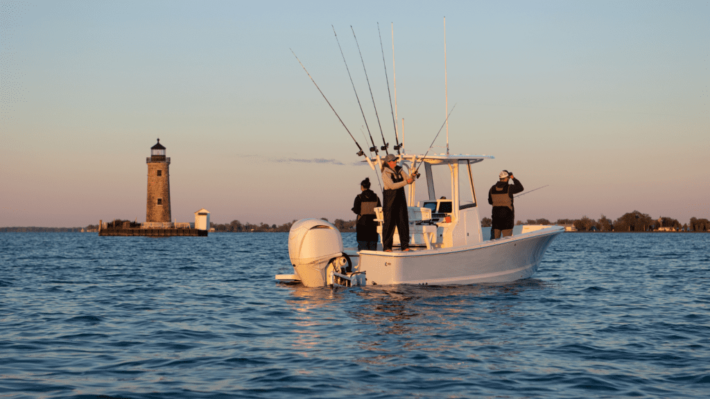 Fishermen on a motorboat at sunrise