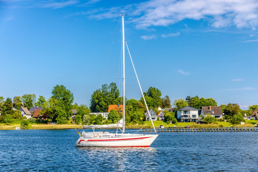 White sailing boat on calm water in Germany