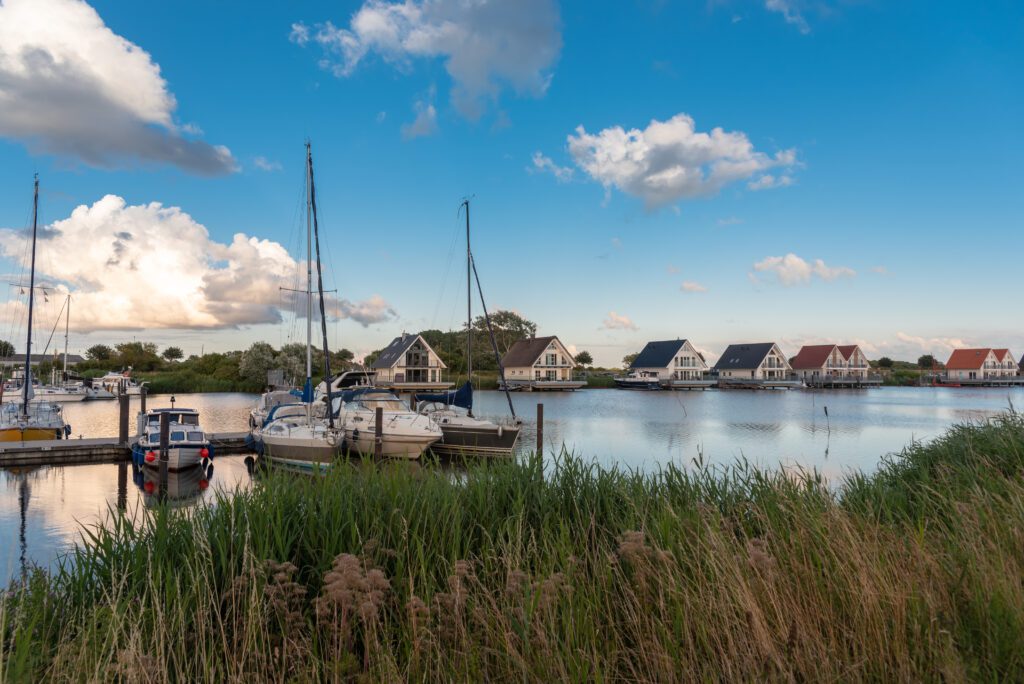 Landscape with sailing boats and yachts on the Harle in Harlesiel, Germany